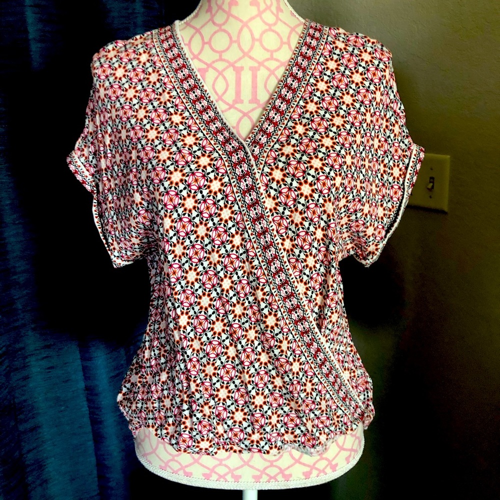 Pink and black wrap top